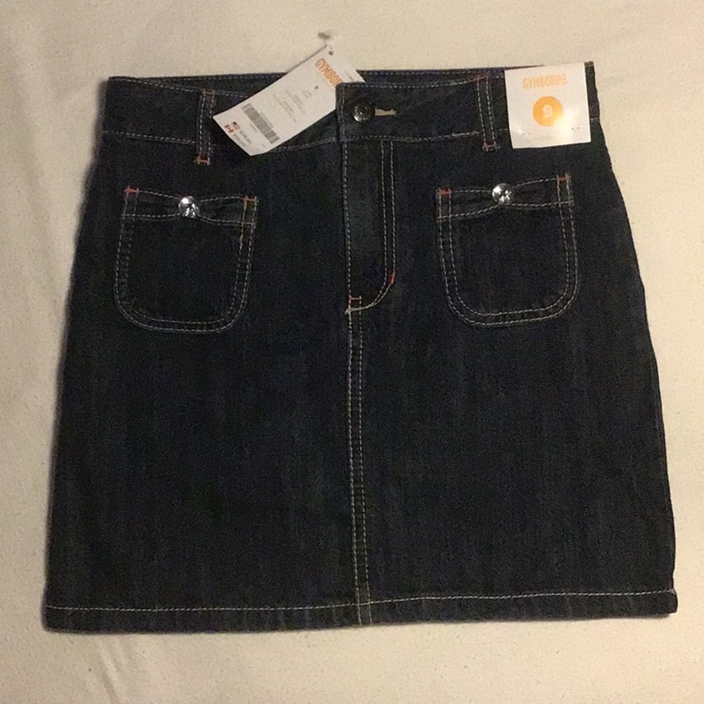 NWT Gymboree girls denim skirt with embellished buttons and ribbon pockets.